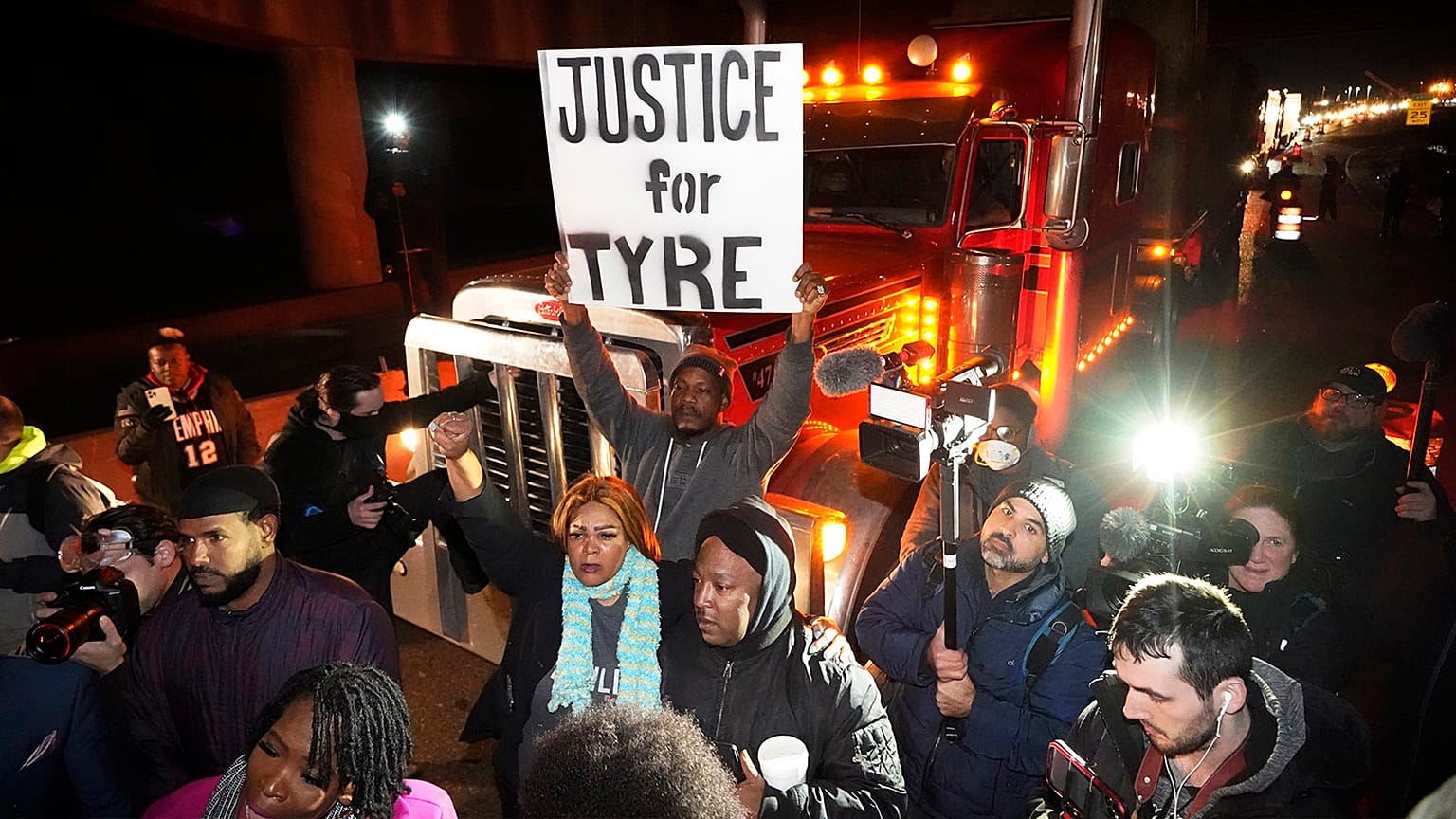 Protesters march down the street in Memphis on 27 January after authorities release footage of depicting five Memphis officers beating Tyre Nichols,