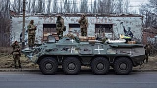 Ukrainian soldiers stand on an armored personnel carrier before going to the frontline in Donetsk region, Ukraine, Saturday, Jan. 28, 2023.