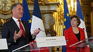 French Foreign Minister Catherine Colonna, right, watches Australian Defense Minister Richard Marles
