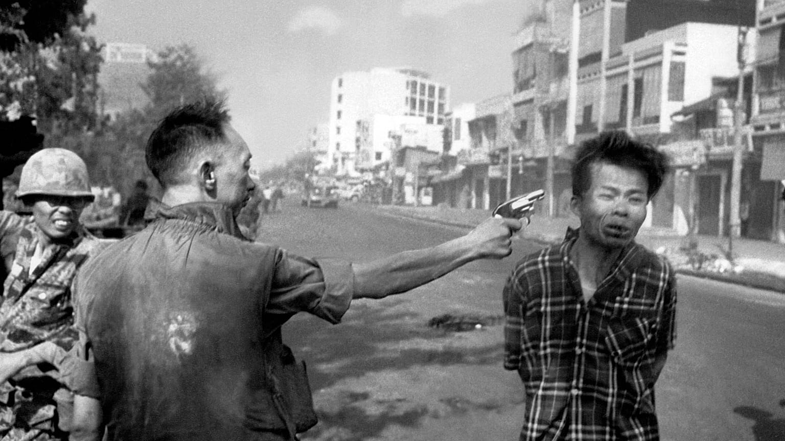 South Vietnamese General Nguyen Ngoc Loan, chief of the National Police, fires his pistol into the head of suspected Viet Cong officer Nguyen Van Lem 