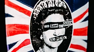 A promotional poster for the 1977 single God Save The Queen by the Sex Pistols on display.