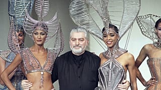 Franco-Spanish fashion designer Paco Rabanne embraces models after the presentation of his spring - summer collection on January 27, 1993 in Paris, France.
