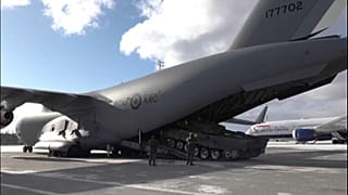 Leopard 2 tank being loaded onto a plane.