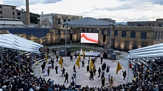 People attend a performance during the inauguration ceremony for the European capital of Culture at Elefsina town, west of Athens, Greece..