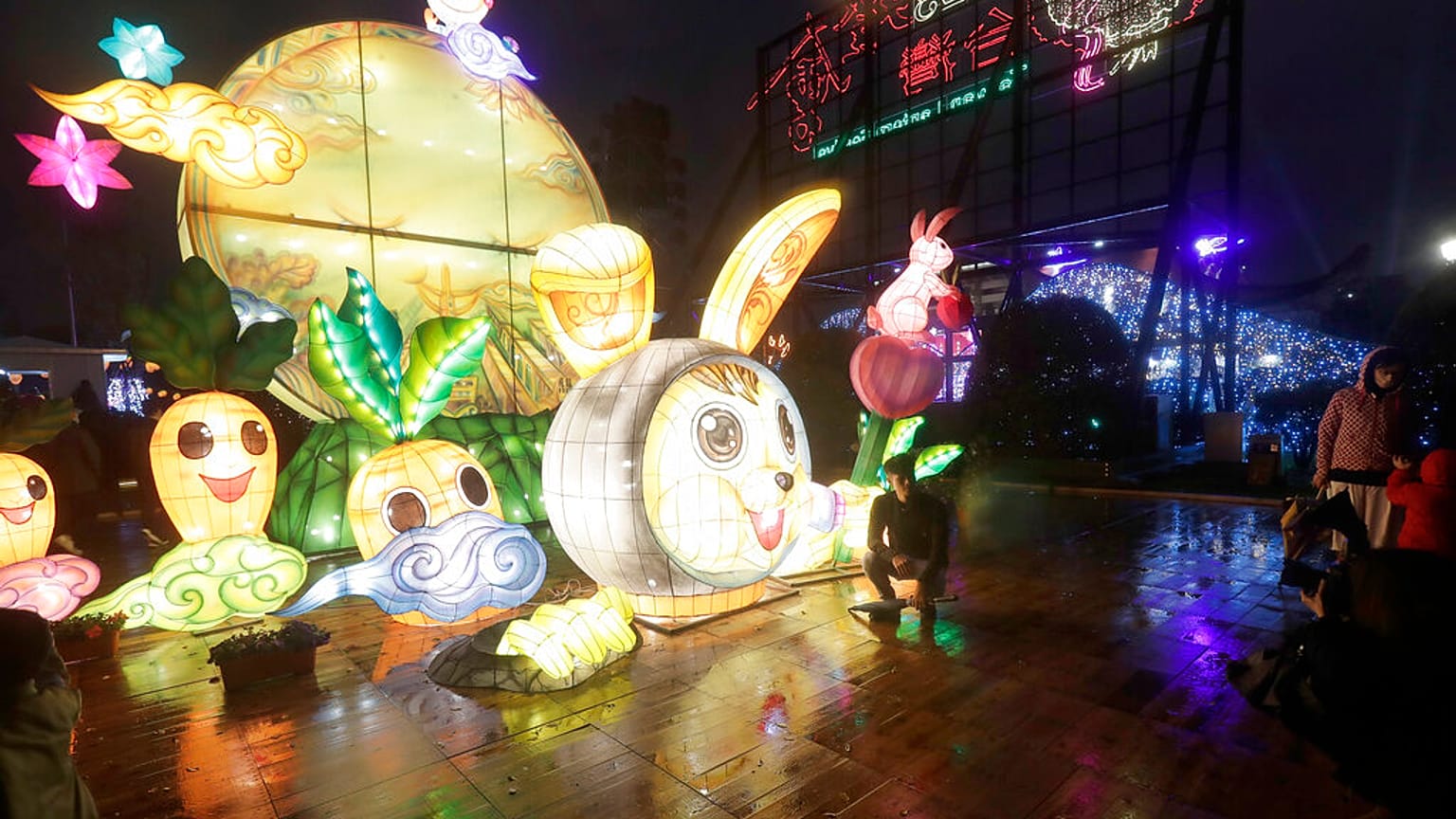 People look at lanterns for the Lantern Festival, marking the end of the Chinese lunar New Year celebrations in Taipei, Taiwan, Sunday, Feb. 5, 2023.