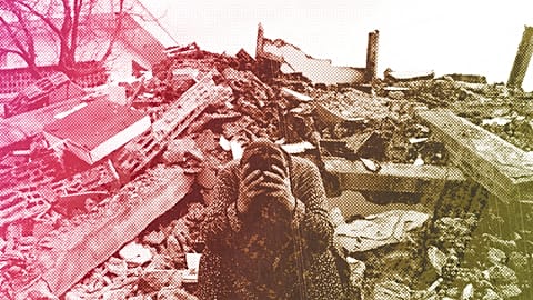 A woman sits on the rubble as emergency rescue teams search for people under the remains of destroyed buildings in Nurdagi town on the outskirts of Osmaniye, 7 February 2023
