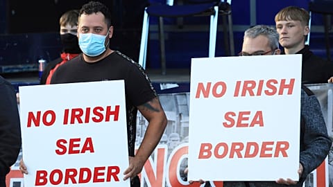 FILE: Loyalists opposed to the Northern Ireland Protocol protest in Newtownards town centre, Northern Ireland, Friday, June 18, 2021.