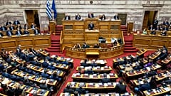FILE: Greek Prime Minister Kyriakos Mitsotakis speaks during a parliament session, 17 December 2022