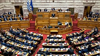 FILE: Greek Prime Minister Kyriakos Mitsotakis speaks during a parliament session, 17 December 2022
