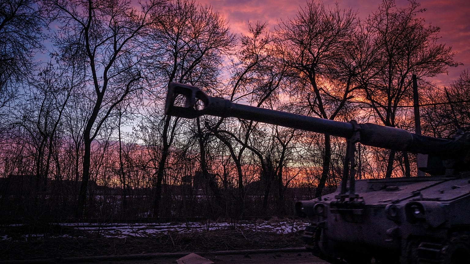 A Ukrainian self-propelled howitzer runs at sunset in the Donetsk region on February 9, 2023, amid the Russian invasion of Ukraine.