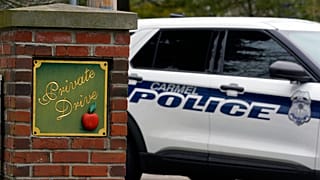 Carmel, Ind. police secure the entrance to the neighborhood of former Vice President Mike Pence's Indiana home, Friday, Feb. 10, 2023 in Carmel, Ind.