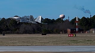 This photo provided by the U.S. Air Force shows a U.S. Air Force pilot taking off in an F-22 Raptor at Joint Base Langley-Eustis, Va., Saturday, Feb. 4, 2023.