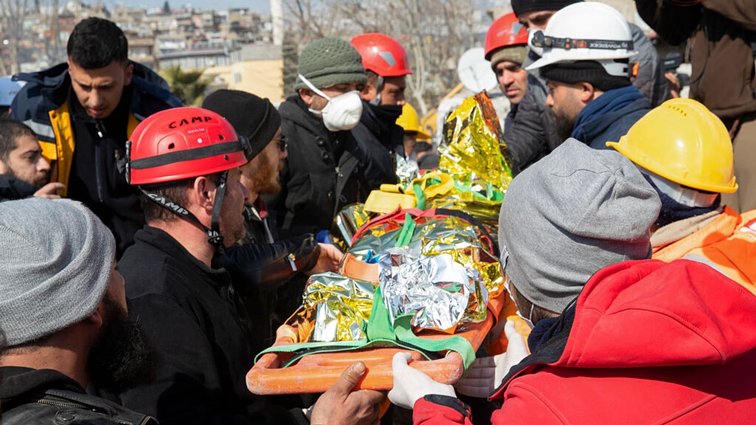 Ayse, a six-year-old girl from Syria who survived under a destroyed building, is carried on a stretcher by rescue teams in Kahramanmaras, Turkey, Saturday, Feb. 11