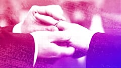 A man puts a wedding ring on his partner's finger as their civil union is being registered during a ceremony in Rome's Campidoglio, March 2015.
