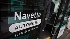 Inscription reading "Autonomous shuttle" is seen on an experimenting self-driving shuttle linking two train stations, Tuesday, Jan. 24, 2017 in Paris.