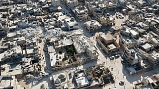 An aerial view shows collapsed buildings following last week's earthquake in Syria's rebel-held village of Atarib.