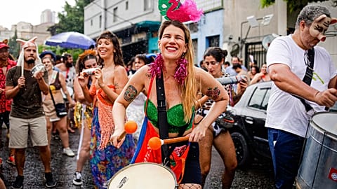 Revelers take part in the "Broco Burocra" or "bureaucracy" street block party in Sao Paulo, Brazil, Saturday, Feb. 11, 2023.