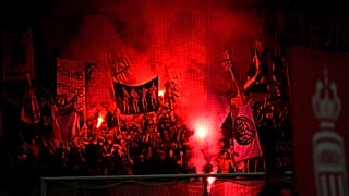 Nice's team fans light flares before the League One soccer match between Nice and Monaco at the Allianz Riviera stadium in Nice, Sunday, Sept. 4, 2022