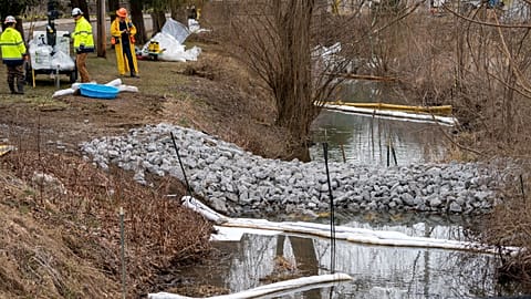 Cleanup continues in a stream in East Palestine Park in East Palestine, Ohio
