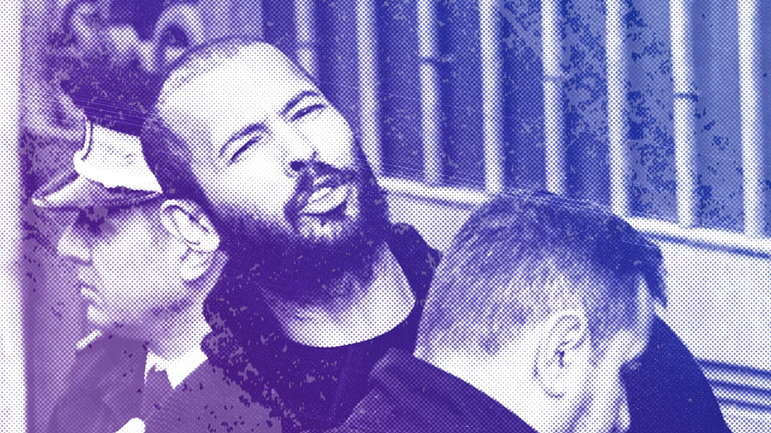 Police officers escort Andrew Tate handcuffed to his brother Tristan Tate, to the Court of Appeal in Bucharest, 1 February 2023