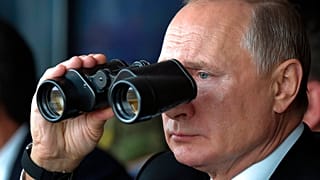 FILE: Russian President Vladimir Putin holds binoculars while watching military exercises Center-2019 at Donguz shooting range near Orenburg, Russia, Sept. 20, 2019. 