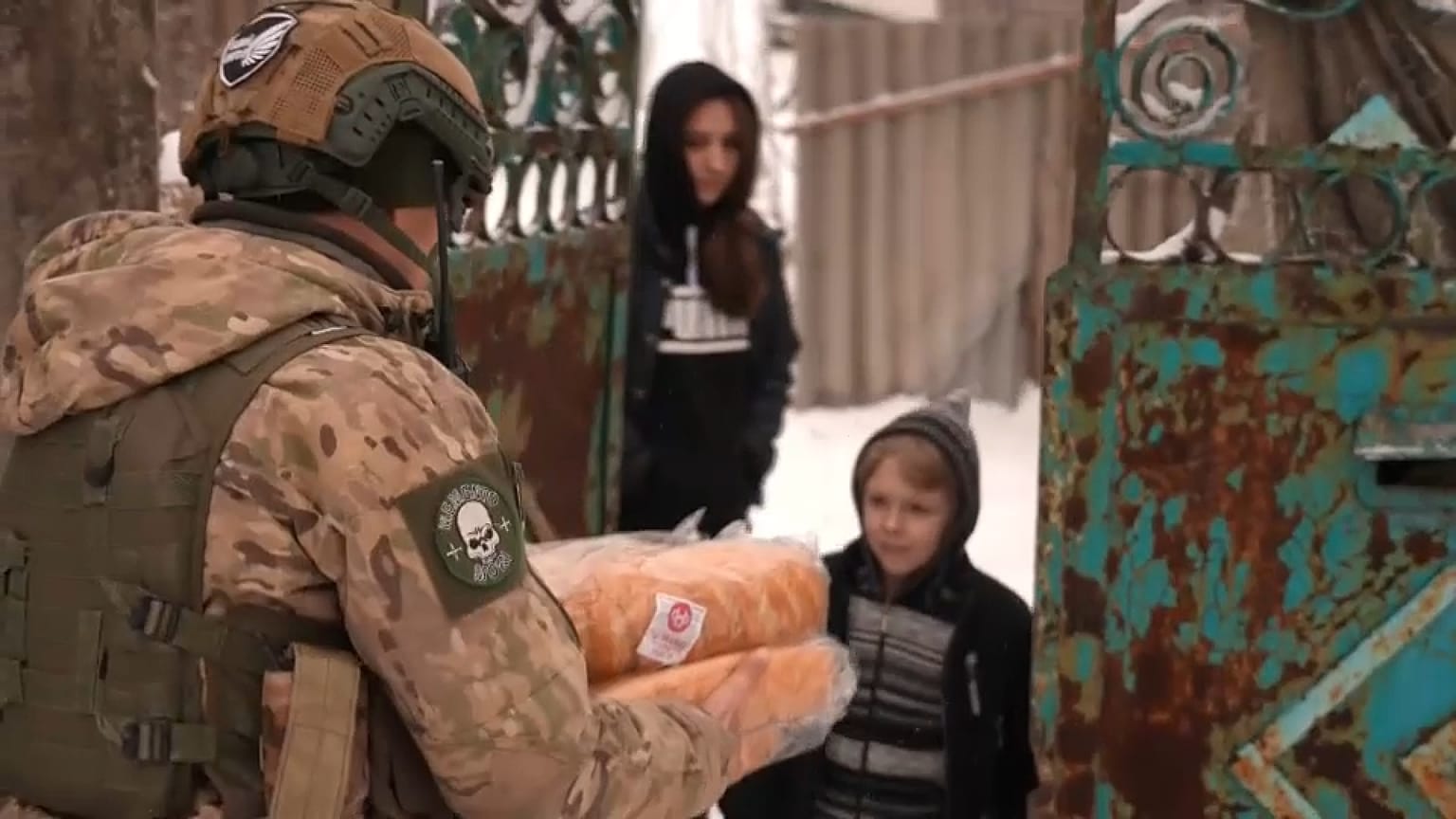 A member of Ukraine's White Angels unit delivers bread to a family in Krasnohorivka, a city on the front line. 18 Feb, 2023