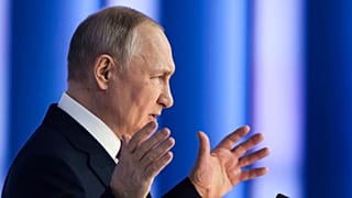 Russian President Vladimir Putin gestures as he gives his annual state of the nation address in Moscow, Russia, Tuesday, Feb. 21, 2023. 