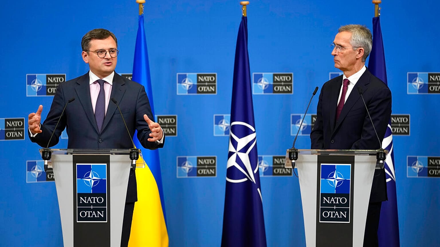 Ukraine's Foreign Minister Dmytro Kuleba, left, and NATO Secretary General Jens Stoltenberg address a media conference at NATO headquarters in Brussels, Tuesday, Feb. 21, 2023