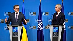 Ukraine's Foreign Minister Dmytro Kuleba, left, and NATO Secretary General Jens Stoltenberg address a media conference at NATO headquarters in Brussels, Tuesday, Feb. 21, 2023