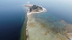 A drone image shows San Biagio island, affected by drought in Lake Garda, near Lido di Manerba, Italy.