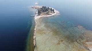 A drone image shows San Biagio island, affected by drought in Lake Garda, near Lido di Manerba, Italy.