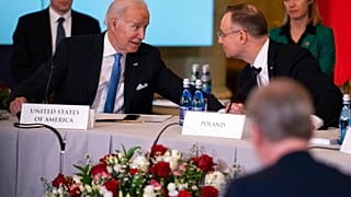 President Joe Biden talks with Polish President Andrzej Duda during a meeting with the leaders of the Bucharest Nine, Wednesday, Feb. 22, 2023, in Warsaw.