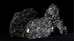 Pieces of lithium sparkle in an ore sample in Prague, Czech Republic, on March 28, 2017.