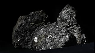 Pieces of lithium sparkle in an ore sample in Prague, Czech Republic, on March 28, 2017.