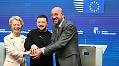 Ursula von der Leyen, Volodymyr Zelenskyy, and Charles Michel join hands after addressing a media conference at an EU summit in Brussels on Thursday, Feb. 9, 2023.