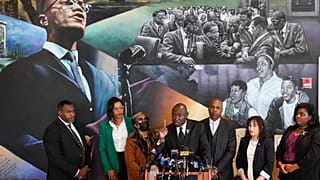 Attorney Ben Crump, center, speaks during a news conference at the Malcolm X & Dr. Betty Shabazz Memorial and Educational Center in New York, Tuesday, Feb. 21, 2023.