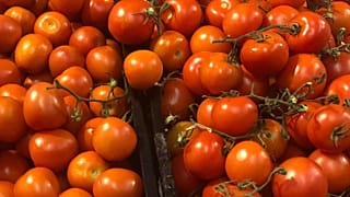 FILE: Tomatoes on display in supermarket