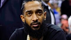 Rapper Nipsey Hussle attends NBA basketball match between Golden State Warriors and Milwaukee Bucks in Oakland, Calif., March 29,  2019