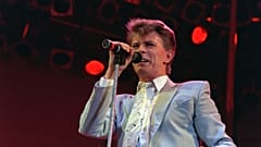 Rock star David Bowie performs on stage at Wembley Stadium, London, July 13, 1985