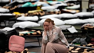 A Ukrainian woman in a gymnasium used as a refugee centre in Przemyśl, Poland on 8 March 2022