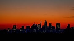 The sun is about to rise behind the buildings of the banking district in Frankfurt, Germany, Wednesday, March 9, 2022