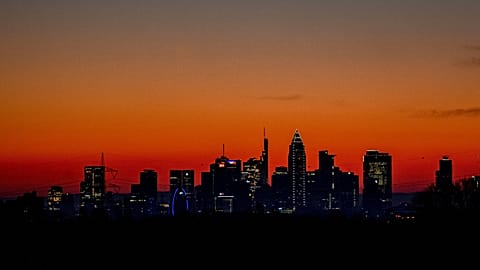 The sun is about to rise behind the buildings of the banking district in Frankfurt, Germany, Wednesday, March 9, 2022