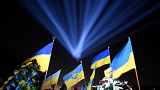 A symbolic "ray of memory" illumination at the graves of Ukrainian soldiers who died in the Russia's war at Lychakiv Cemetery in Lviv, Ukraine, February 23, 2023.
