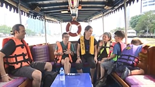 The Family boarding a boat in Bangkok, Thailand.