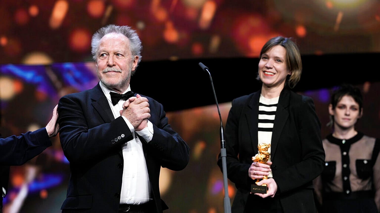 Nicolas Philibert, left, director of the documentary "Sur lAdamant" ("On the Adamant"), receives the Golden Bear for Best Film