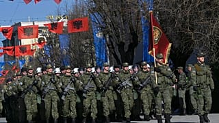 Kosovo Security Force members march during celebrations to mark the 15th anniversary of independence, in Pristina, Kosovo, Friday, Feb. 17, 2023.