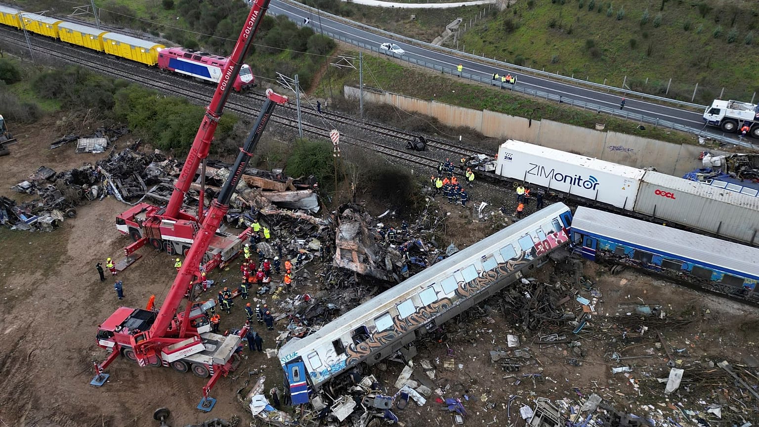 Cranes remove debris after a collision in Tempe, about 376 kilometres (235 miles) north of Athens, near Larissa city