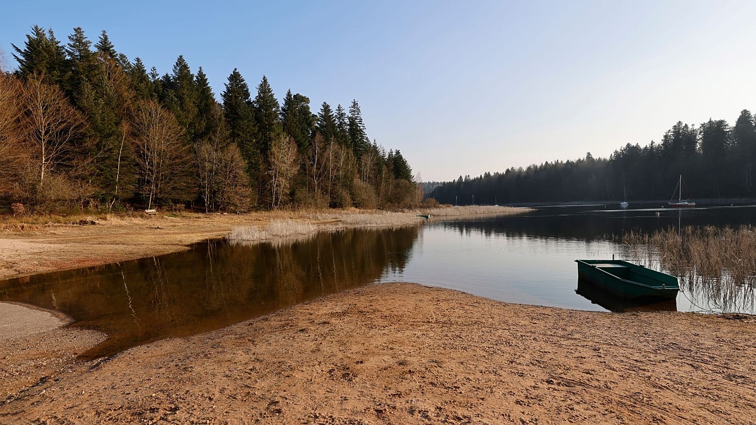 A small boat floats on the the Pierre-Percee lake, eastern France, Wednesday, March 1, 2023. France recorded 32 days without rain this winter.