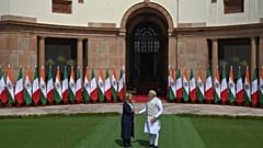 Italian Premier Giorgia Meloni, left, and Indian Prime Minister Narendra Modi, pose for the media before their meeting in New Delhi, India, Thursday, March 2, 2023.