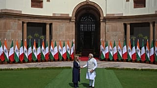 Italian Premier Giorgia Meloni, left, and Indian Prime Minister Narendra Modi, pose for the media before their meeting in New Delhi, India, Thursday, March 2, 2023.